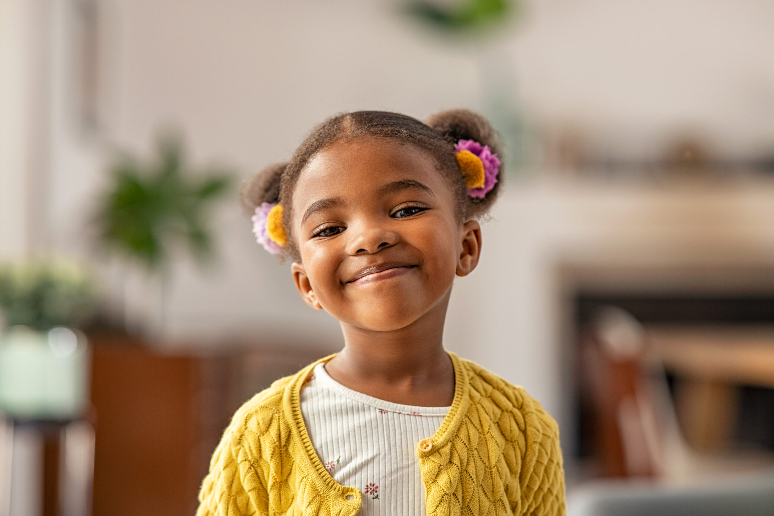 Young Student Smiling In Classroom.