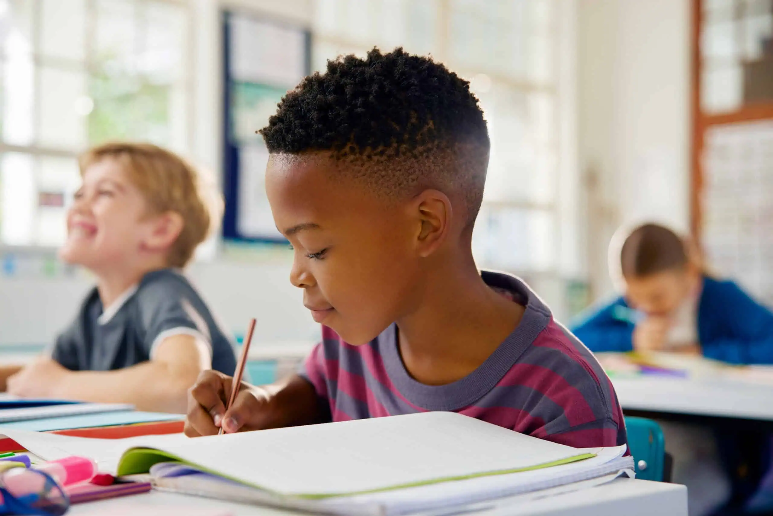 A picture of a young student studying demonstrating the type activities in which students will partake in at LRCA.