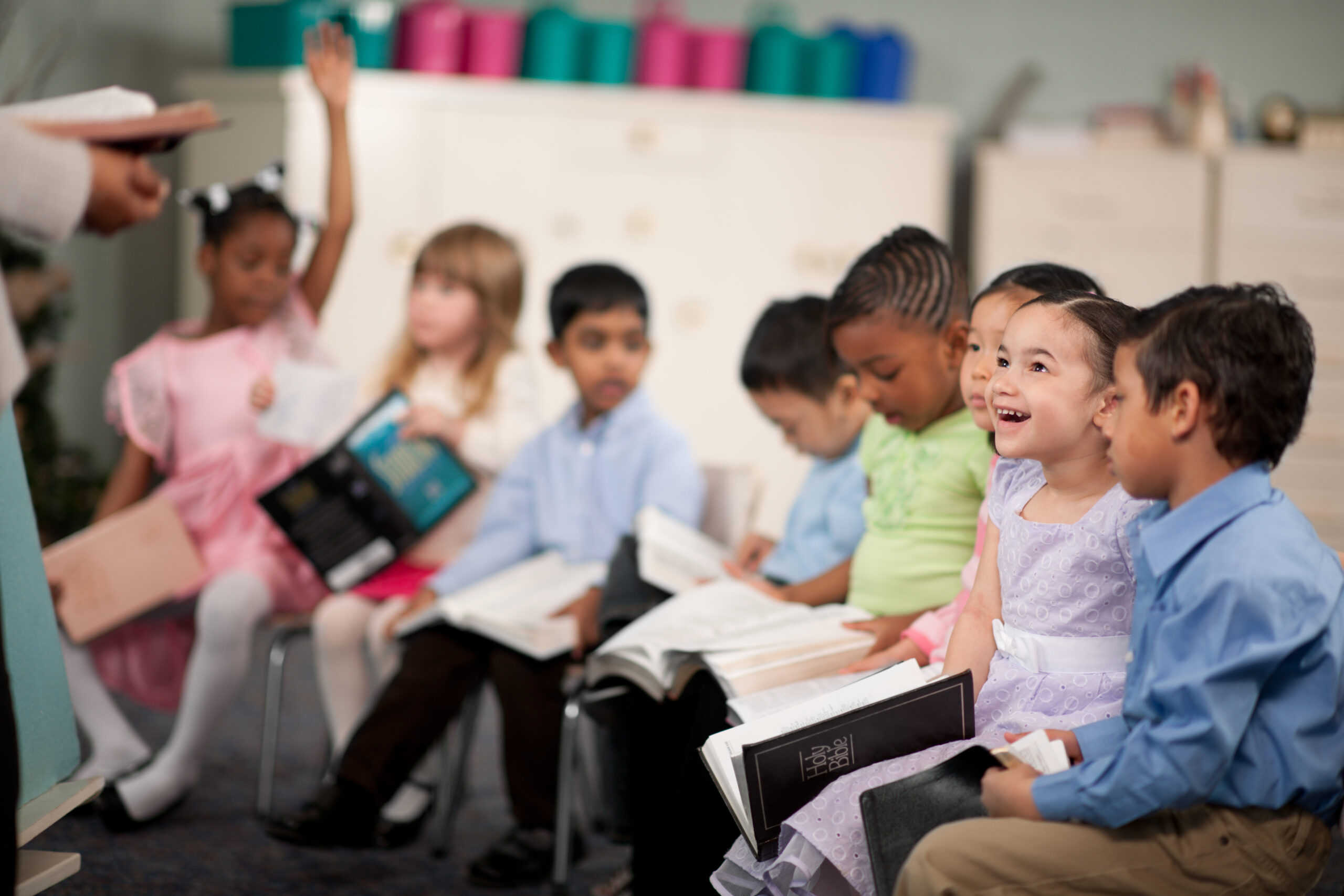 This is an image of a group of young students engaged in Bible Class to demonstrate the type of activities at LRCA.