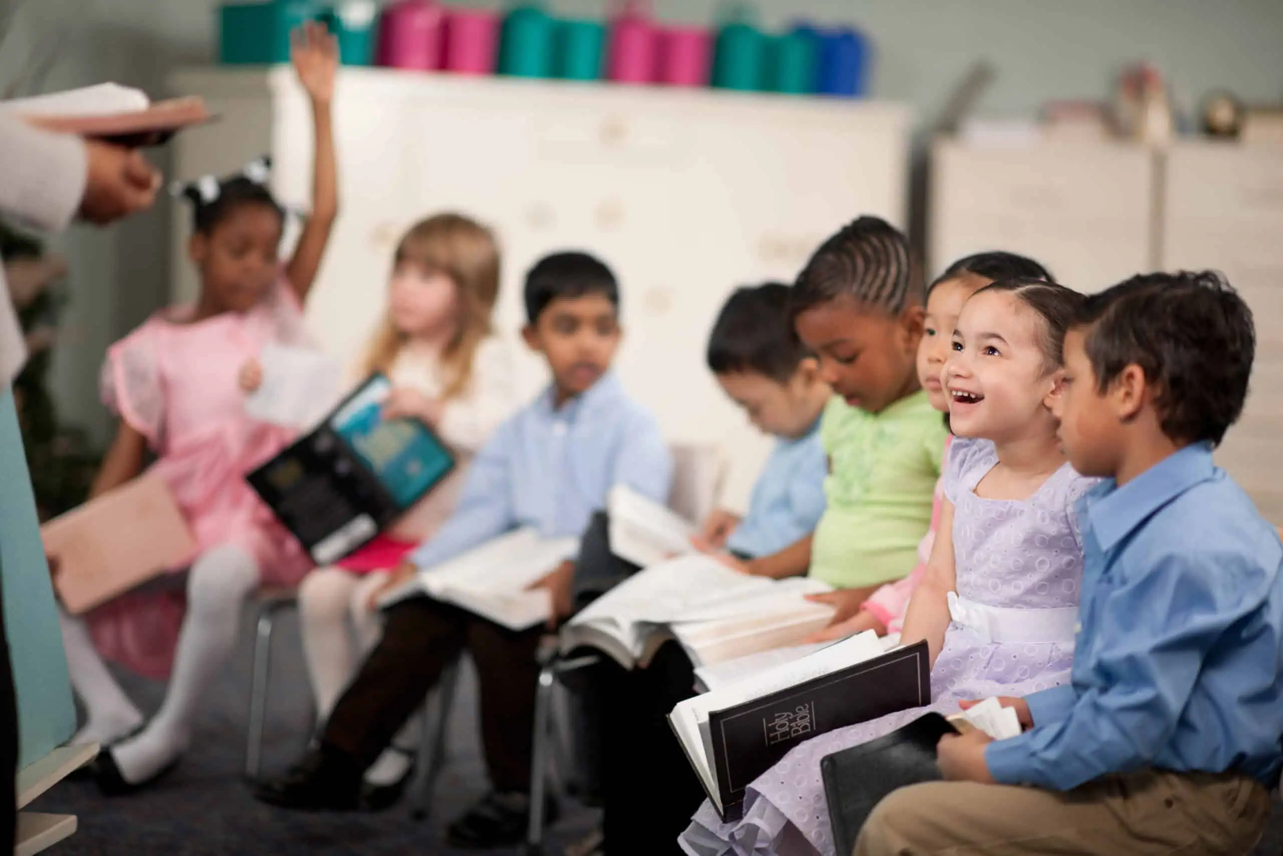 This is an image of a group of young students engaged in Bible Class to demonstrate the type of activities at LRCA.